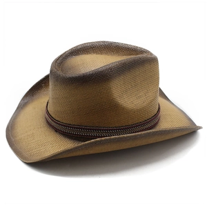 Detail of hand-woven straw cowboy hat with gradient spray paint and ethnic woven band