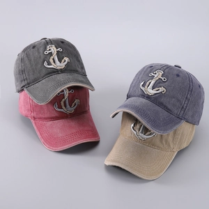 Detailed close-up of embroidered anchor logo on various washed cotton baseball caps