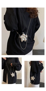 Détail du mini sac étoile argenté avec perle décorative et fine bandoulière chaîne