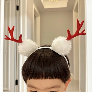 Christmas reindeer headband for kids with shiny red sequins and white fluffy pom-poms