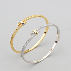 Elegant gold and silver T-shaped open bangles set with sparkling cubic zirconia accents