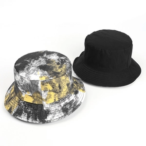 Detail showing high-quality stitching on black and tie-dye reversible bucket hats