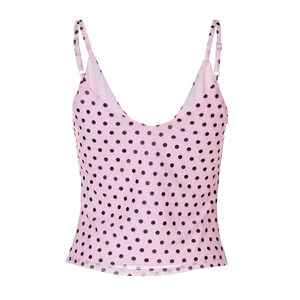 Close-up detail of pink polka dot camisole featuring high-quality fabric and V-neck design