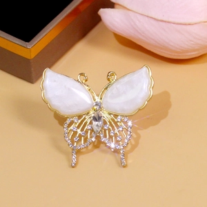 Elegant gold butterfly brooch with white pearls and sparkling rhinestones for women