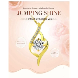 Detail of gold heart pendant necklace featuring a floating dancing zircon stone and wave design