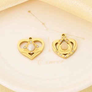 Detail of gold heart charms with I LOVE YOU engraving and sparkling zircon accents