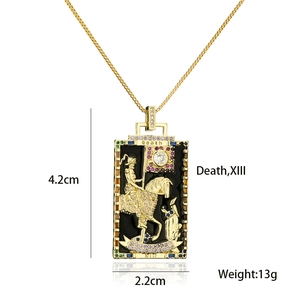 Detail of tarot card death pendant with gold relief and crystals 4.2cm x 2.2cm