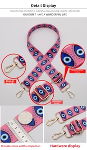 Detail of adjustable ethnic strap with evil eye pattern and golden metal swivel hooks