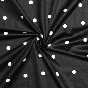 Detailed view of polka dot fabric texture with soft drapes and high quality material