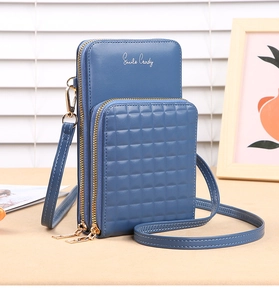 Detail view of the Morandi blue crossbody phone bag with embossed textured pocket
