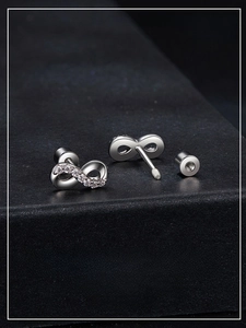 Detailed shot of infinity moissanite earrings with secure screw-back posts in S925 silver
