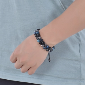 Detail of men's double-layer blue tiger eye and black magnetic stone woven bracelet