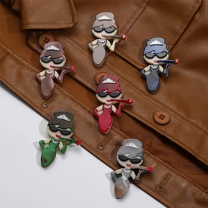 Set of 6 minimalist acrylic brooches with marble texture on a brown leather jacket