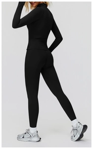 Detailed back view of women's black high-waisted thermal yoga leggings and long sleeve top