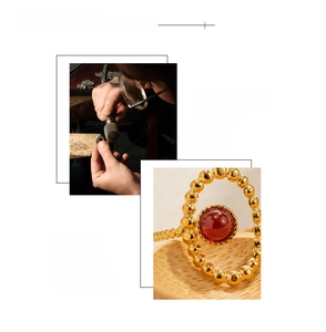 Detail of 18K gold-plated ring with red gemstone showing hand-polished texture