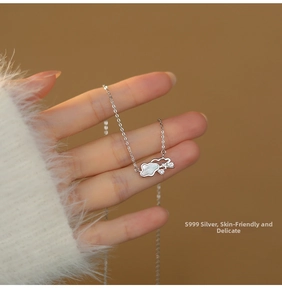 Detail of S999 sterling silver cloud necklace with white mother of pearl and small diamonds