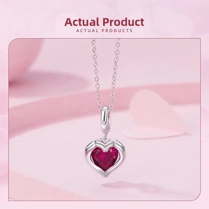 Close-up of S925 sterling silver necklace featuring a large red heart-shaped gemstone