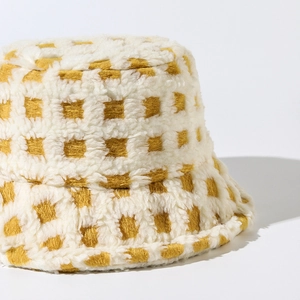 Winter plaid sherpa bucket hat in yellow and white check pattern for warm weather
