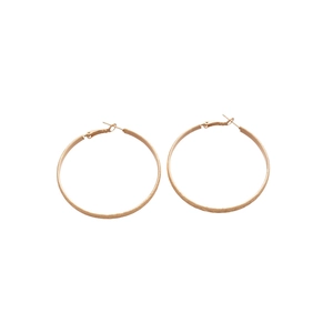 Minimalist gold hoop earrings with matte textured finish and sterling silver needles