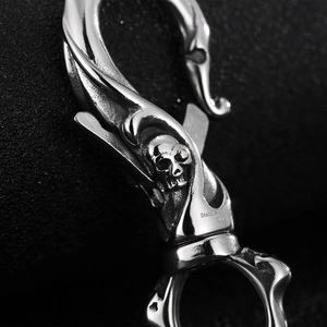 Macro view of 316L stainless steel lobster clasp with detailed 3D skull engraving