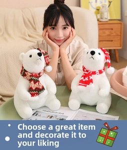 Close-up of plush Christmas polar bears with knitted scarves held by a person