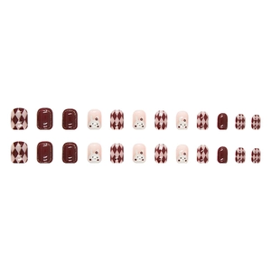 Short square press-on nails with red argyle patterns and cute bunny nail art designs