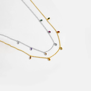 Detail of S925 silver necklace featuring colorful marquise-cut stones in gold and silver
