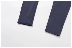 Detailed close-up of flat-seam hem and stitching on recycled high-waist fitness leggings