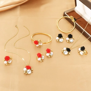 Elegant gold stainless steel jewelry set with red roses, pearls and crystal accents