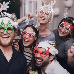 Festive Christmas party glasses and headbands featuring reindeer antlers and holiday designs