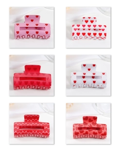 Detailed grid view of six heart-patterned hair claws in various sweet polka dot designs
