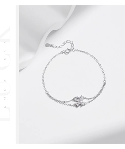 Macro shot of S925 sterling silver stamp and clover pendant with heart-shaped crystals