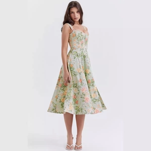 Light green floral sleeveless A-line dress with corset style and sweetheart neckline