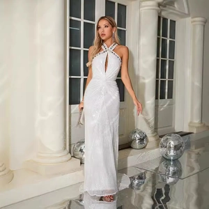 Elegant white halter neck sequin evening gown with chest cutout and slim fit silhouette