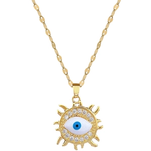 Gold evil eye necklace with sun-shaped pendant and crystals on a flat link chain