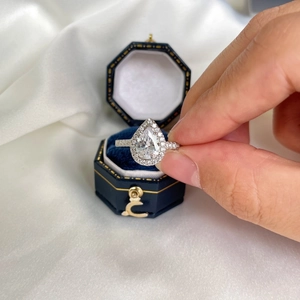 Elegant pear-shaped S925 sterling silver halo ring presented in a velvet jewelry box