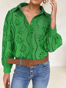 Detail of green hollow-out embroidered long sleeve blouse with button-down design