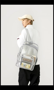 Detailed view of clear waterproof PVC backpack with spacious pockets on male model