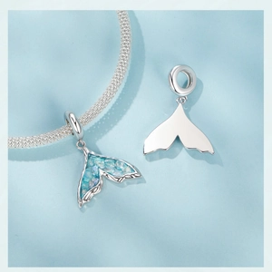 Detailed view of S925 sterling silver mermaid tail charm with sea salt blue inlay and back