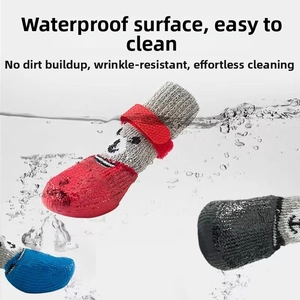 Waterproof dog boots with rubber coating and cartoon bear knit design shown in splashing water