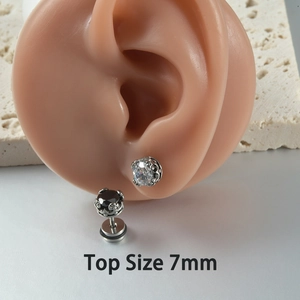 Close-up of 7mm crown zirconia stud earrings with stainless steel base on model
