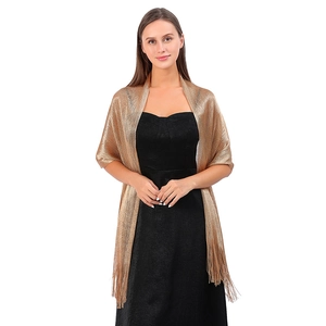 Detailed view of the gold metallic shimmer shawl with elegant long fringe tassel edges
