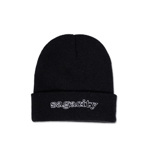 Close-up of black knitted beanie featuring white sagacity embroidery on the cuff