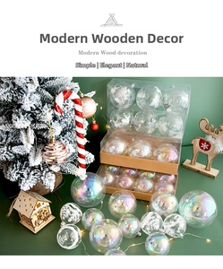 Detail of transparent Christmas balls with elk and snowflake patterns in gift packaging