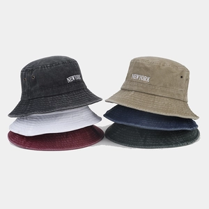 Detail of multi-color vintage washed cotton bucket hats with New York embroidery
