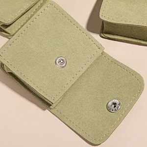 Microfiber suede jewelry pouch in light green with snap button closure for ring storage