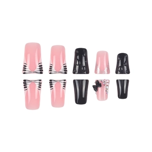 Duckbill false nails with black and white stripes, 3D bows and sparkling rhinestones