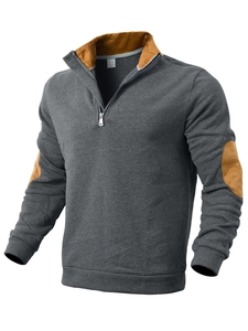 Detail of quarter-zip sweatshirt showing contrast stand collar and elbow patches