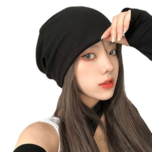 Unisex black knit beanie hat featuring a minimalist slouchy design for autumn and winter