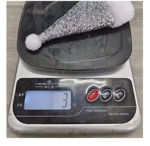 Detailed view of lightweight 3g silver sequined mini Santa hat cutlery holder decor